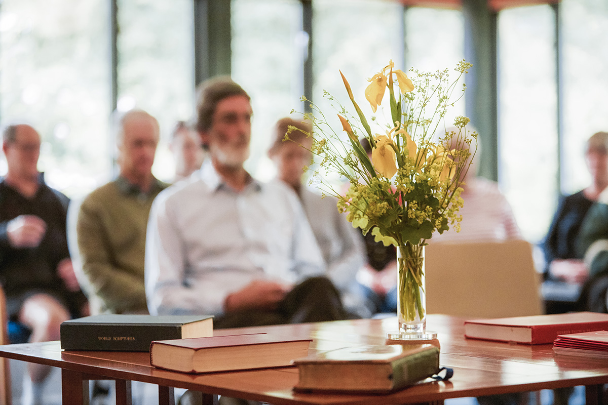 People sit in silence at a Quaker Meeting